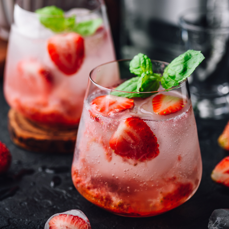 Gin cocktail with soda and strawberries