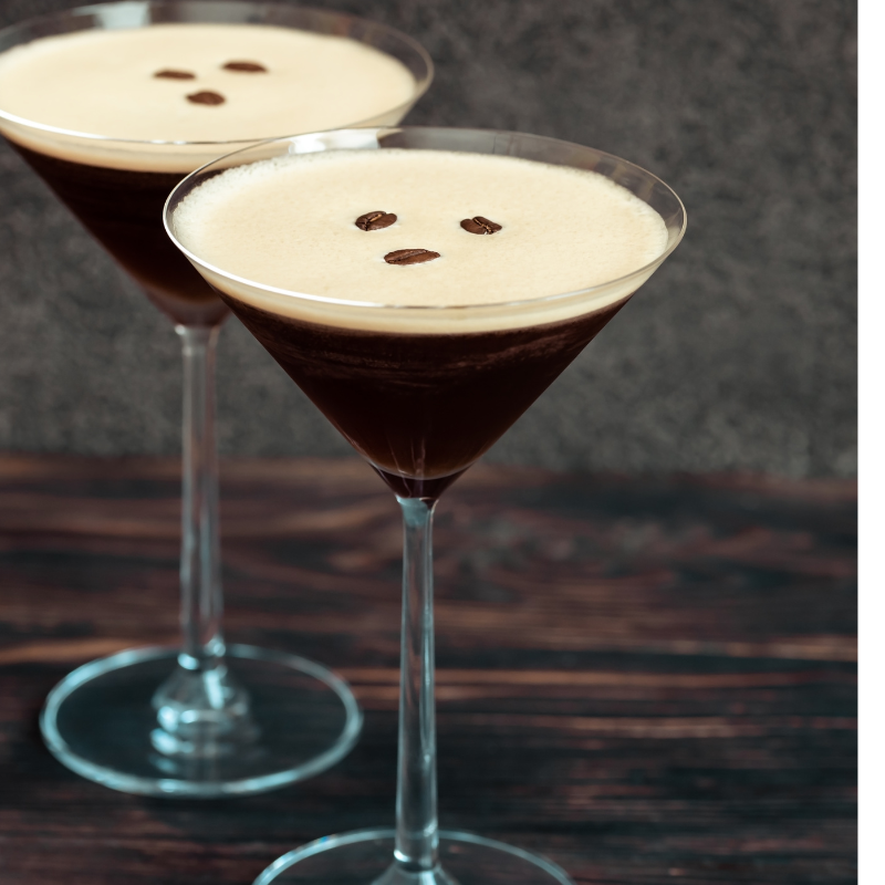 Two cocktail glasses with gin espresso martinis